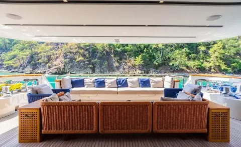 Takara One yacht aft deck seating with white and blue cushions