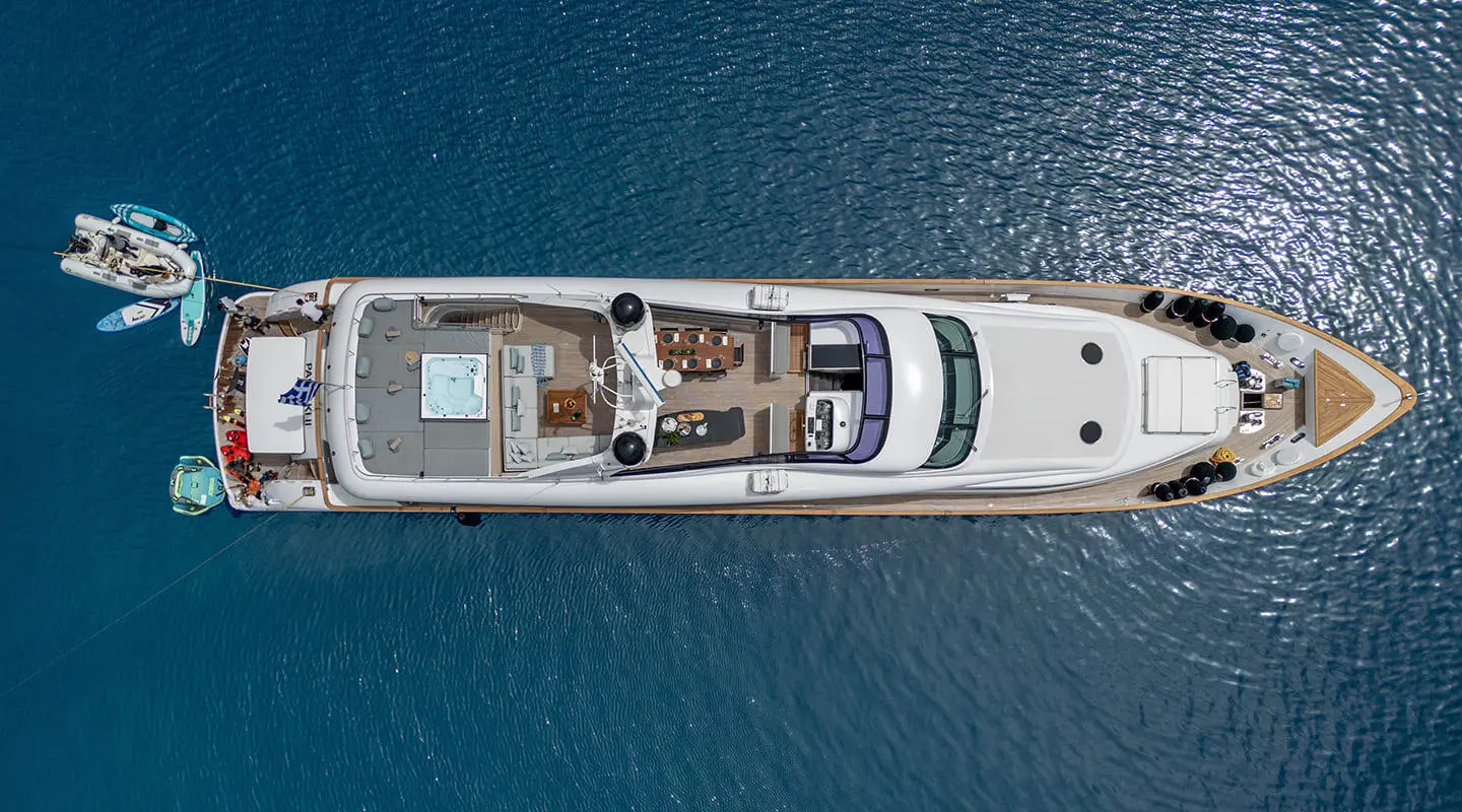 Pareaki II motor yacht anchored in calm water, top-down view