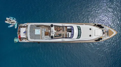 Pareaki II motor yacht anchored in calm water, top-down view