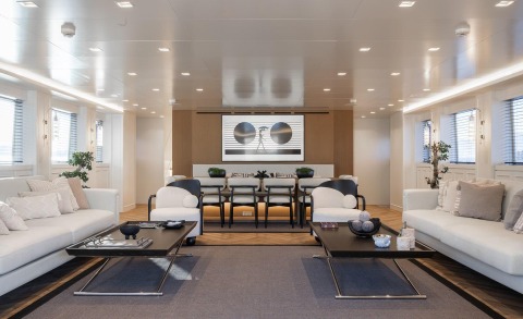 Illusion II luxury yacht lounge interior with white sofas and modern coffee tables