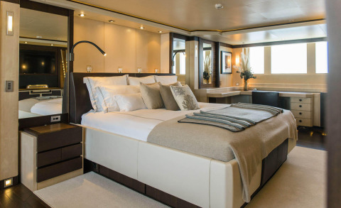 Alalya motor yacht master cabin with a double bed and wood-toned decor
