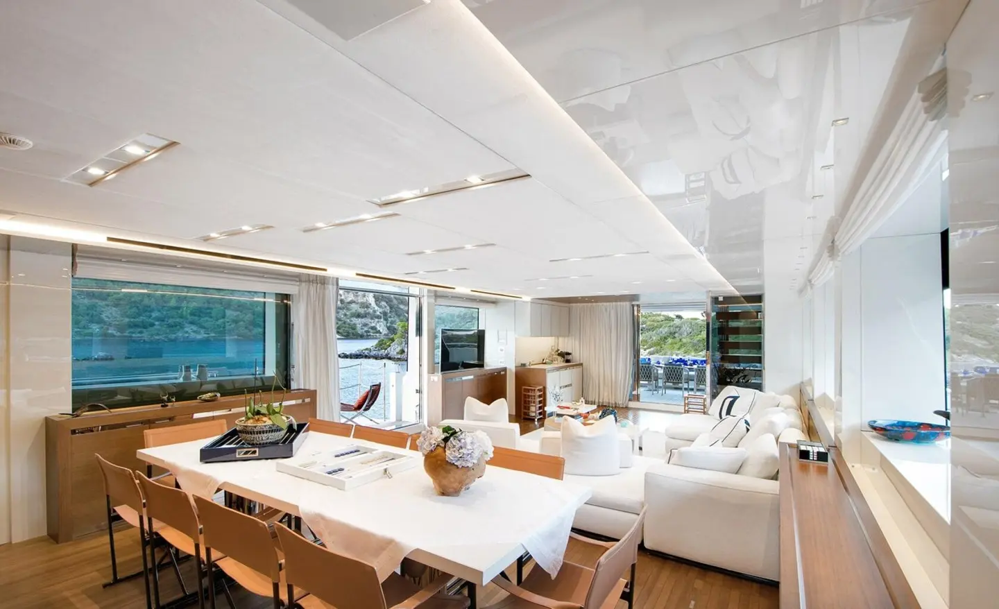 Morning Star yacht interior dining area with a long wooden table and cushioned chairs
