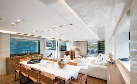 Morning Star luxury yacht interior: bright open-plan dining and lounge area with white furnishings and panoramic sea views