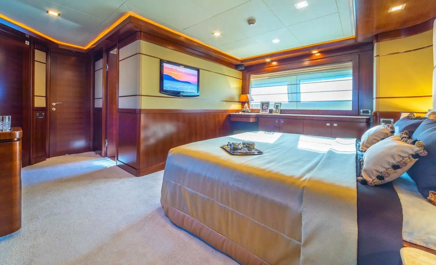 Seventh Sense yacht master cabin with bed and wood furniture