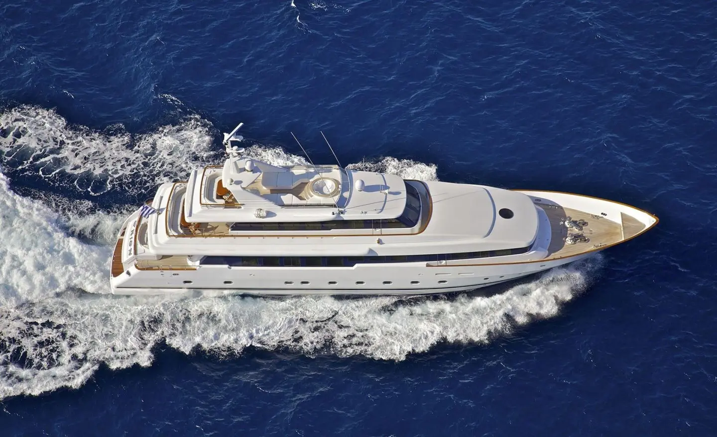Aerial view of the luxury motor yacht O'Rion cruising blue ocean water