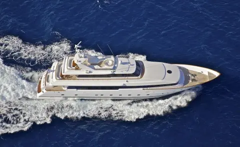 Aerial view of the luxury motor yacht O'Rion cruising blue ocean water