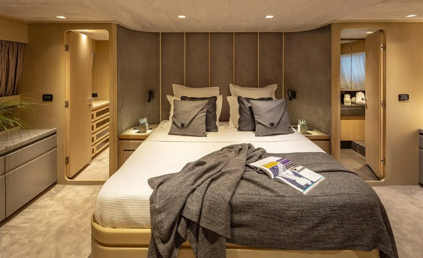 Luxurious master cabin on Summer Fun yacht with plush bedding and neutral tones