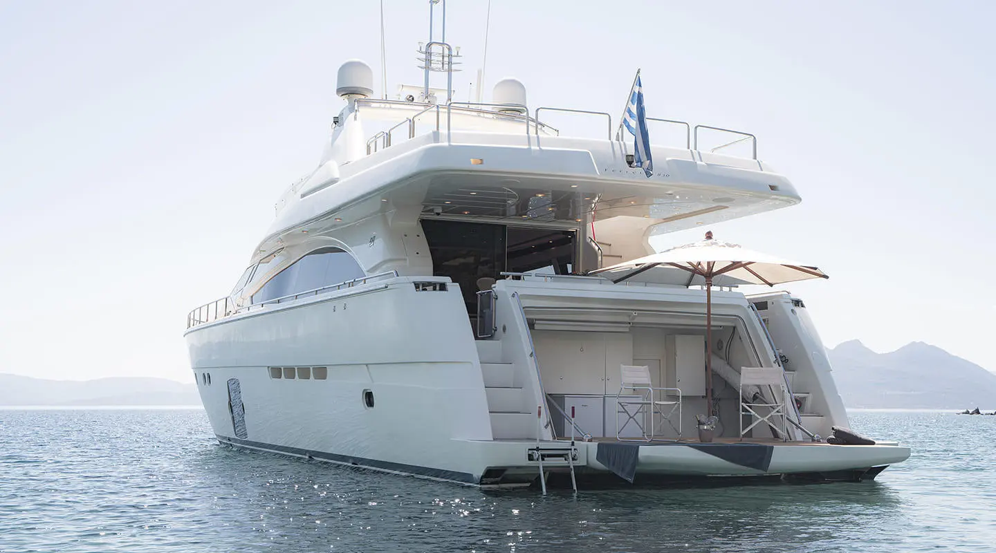 Luxury motor yacht Lidia with open aft deck and shaded seating area