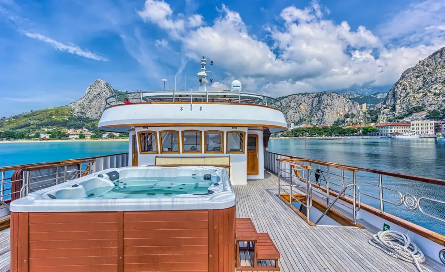 On the Melody motor yacht deck with a Jacuzzi visible