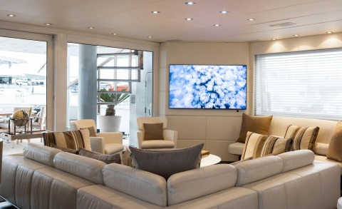 Living area of the Brooklyn motor yacht with large windows