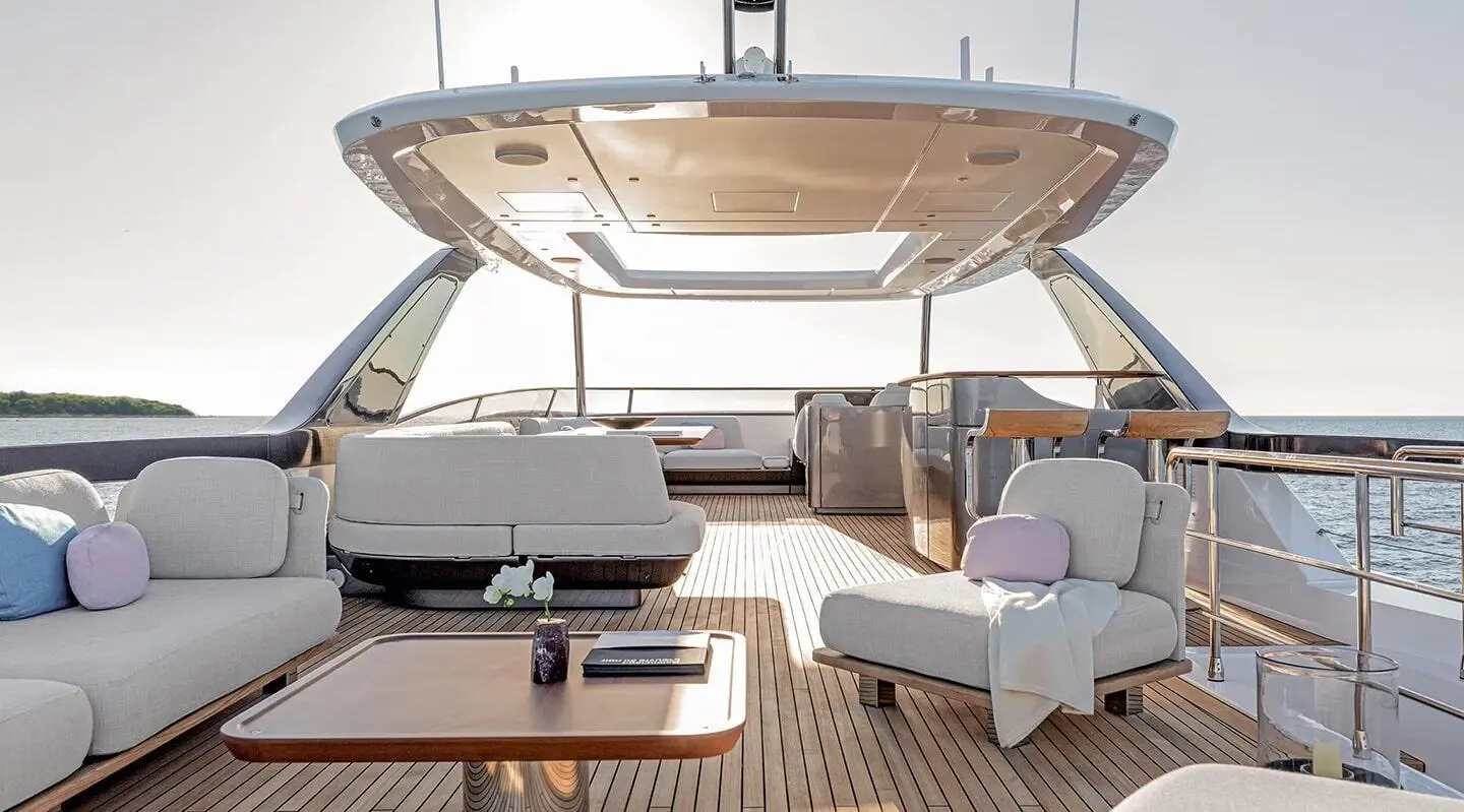 Viva II yacht deck at sunset with seating, wooden flooring, and shaded cockpit