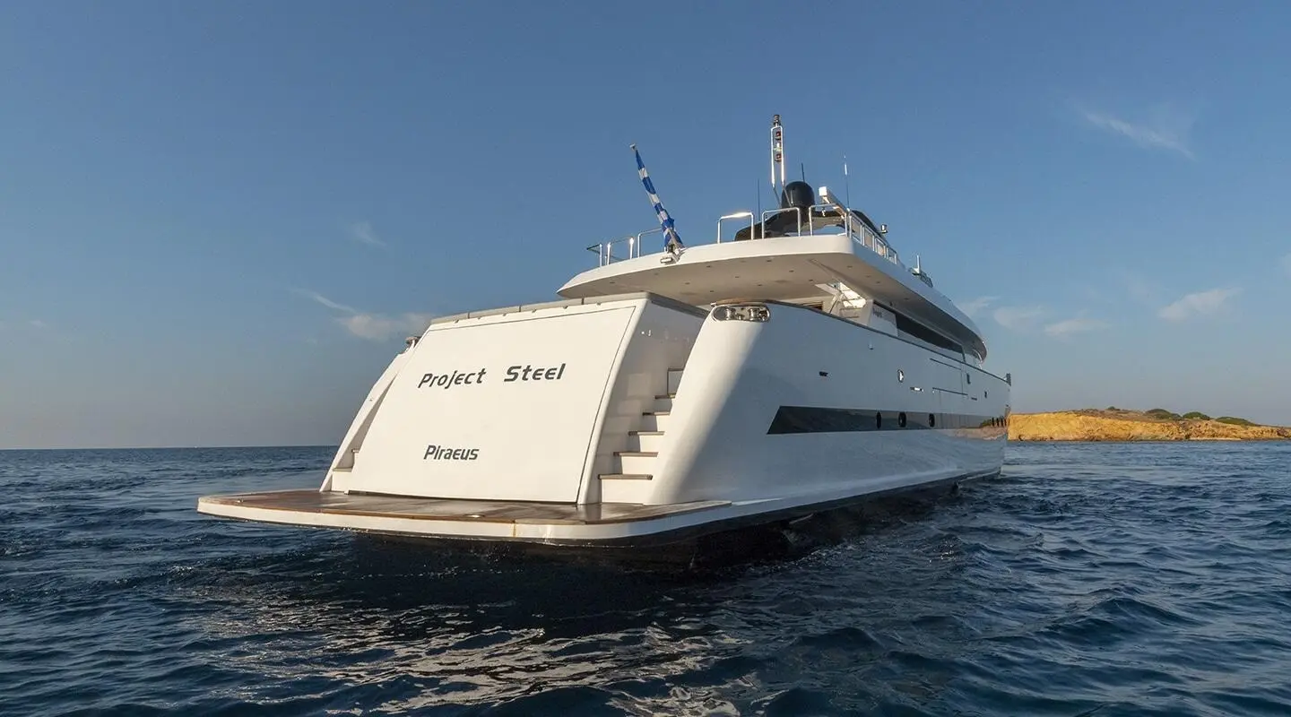 White luxury yacht named Project Steel anchored on calm blue sea