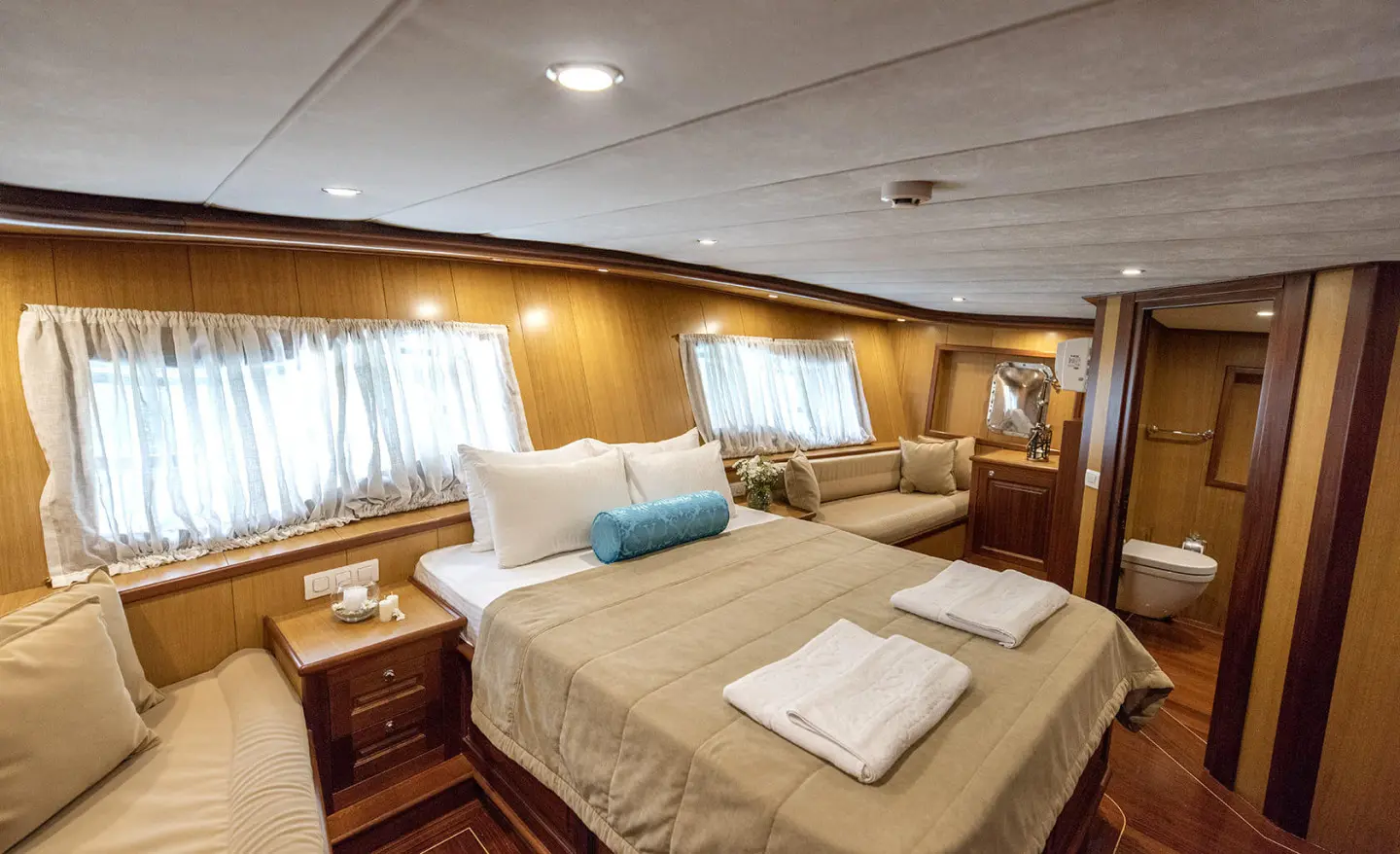Kayhan 3 gulet master cabin with wood paneling and beds
