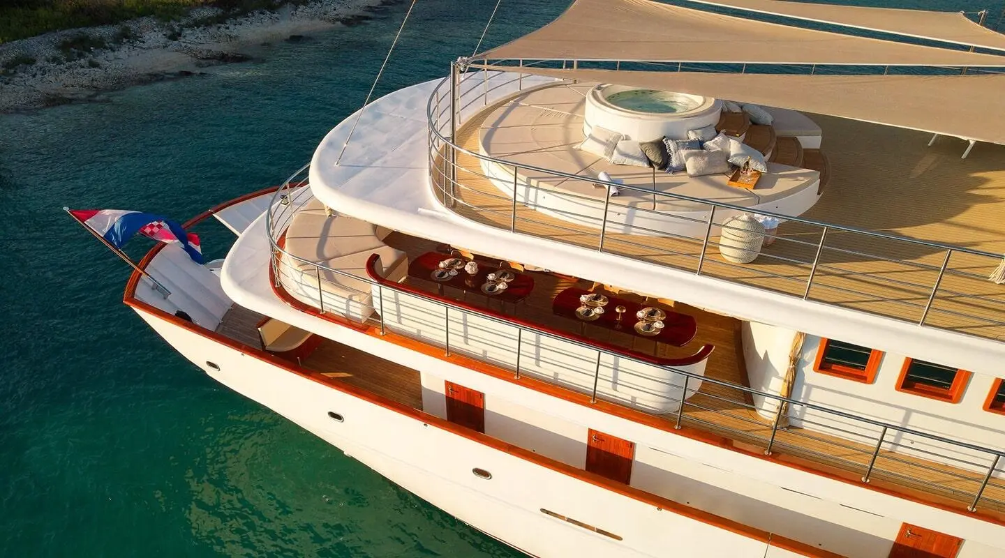 Bellezza motor yacht anchored with deck seating visible