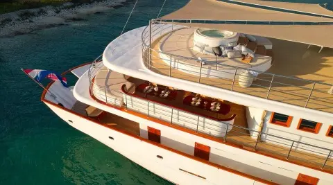 Bellezza motor yacht anchored with deck seating visible