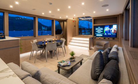 Gulet Good Life saloon interior with dining table and seating.