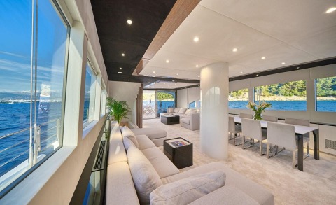 Acapella yacht saloon interior with modern seating and large windows
