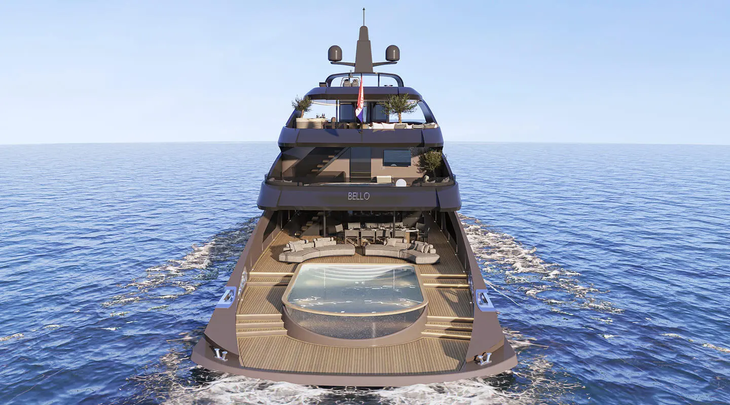 Bello yacht seen from stern on calm sea, clear blue sky overhead