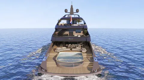 Bello yacht seen from stern on calm sea, clear blue sky overhead