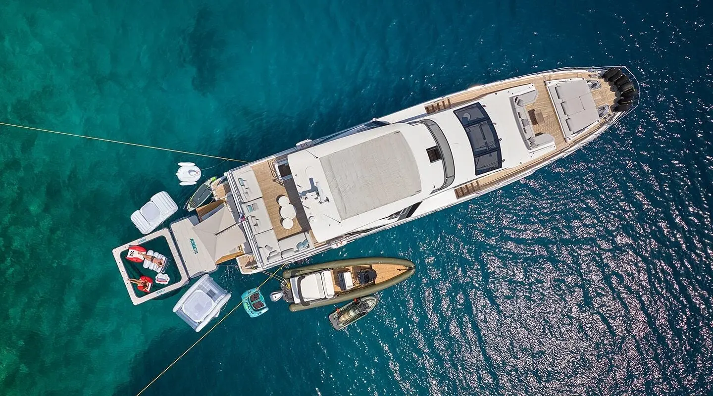 Aerial view of Aluminia Too motor yacht with deck seating and open water around