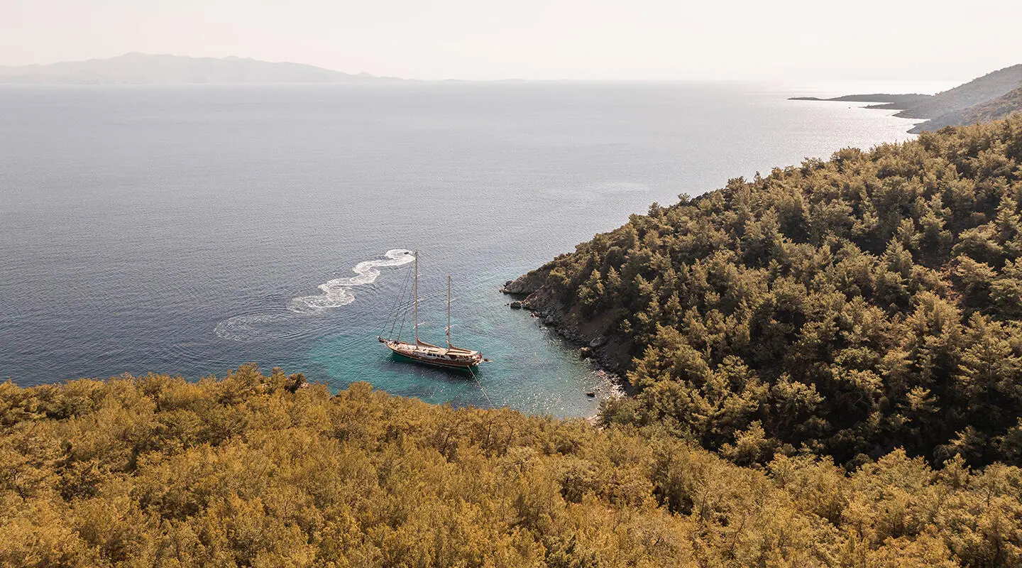 Gulet La Bella Vita viewed from shore with calm sea