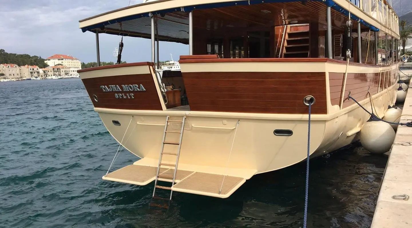 Top deck of Tajna Mora gulet with swimming platform and ladder at stern