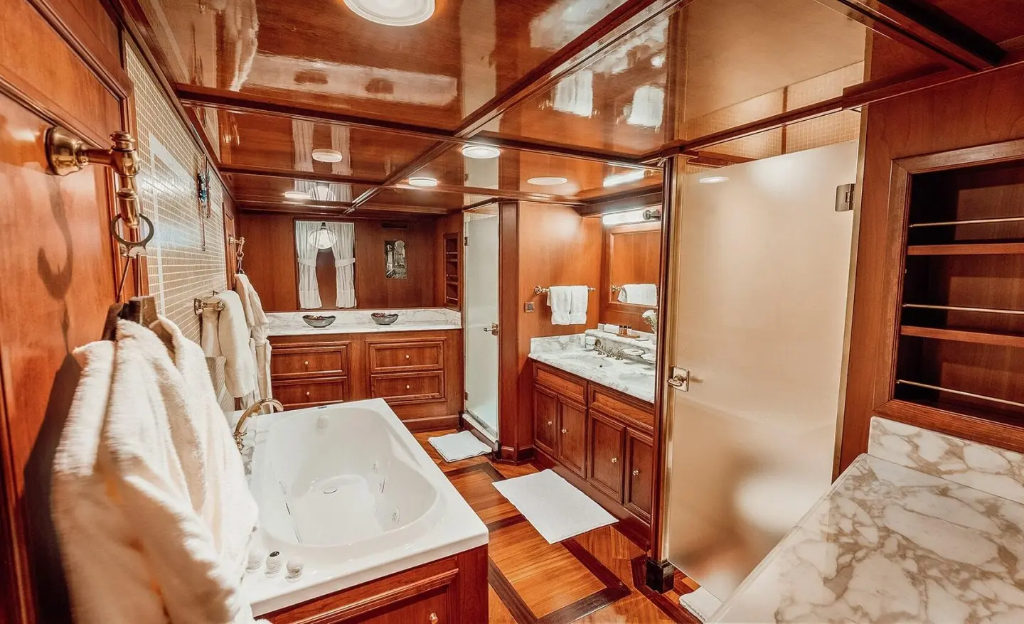 Seagull II luxury yacht bathroom interior with marble surfaces and wooden cabinetry