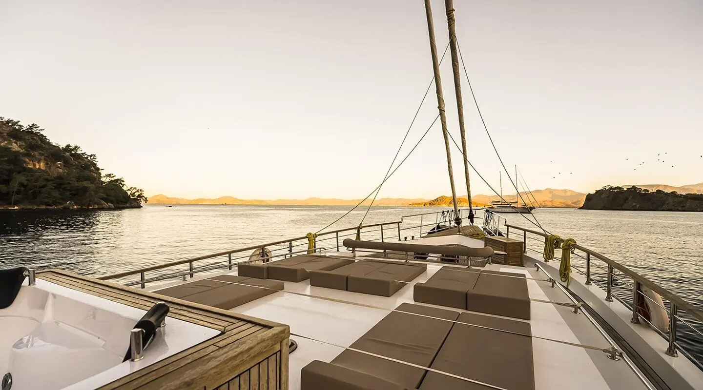 Belgin Sultan yacht deck at sunset with seating areas and sea view