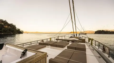 Belgin Sultan yacht deck at sunset with seating areas and sea view