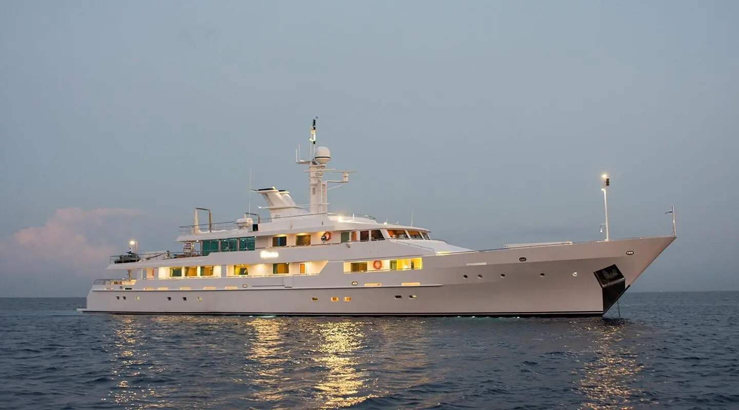 O'Natalina motor yacht anchored on calm water, hull and decks visible