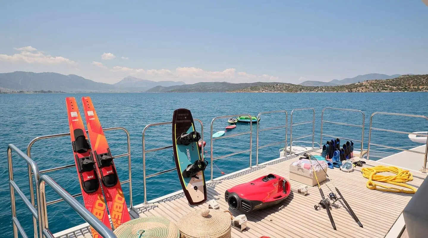 Genny yacht on deck with water sports gear and calm sea