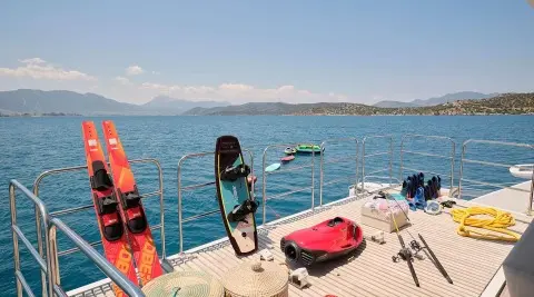 Genny yacht on deck with water sports gear and calm sea