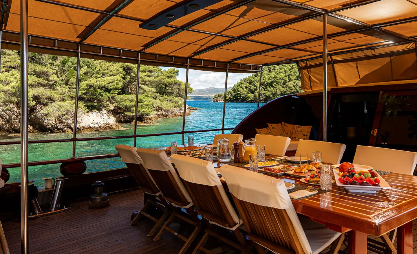 Gulet Eleganza dining onboard on deck with table and chairs