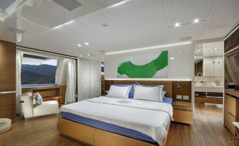 Morning Star yacht master cabin with large bed and built-in cabinets