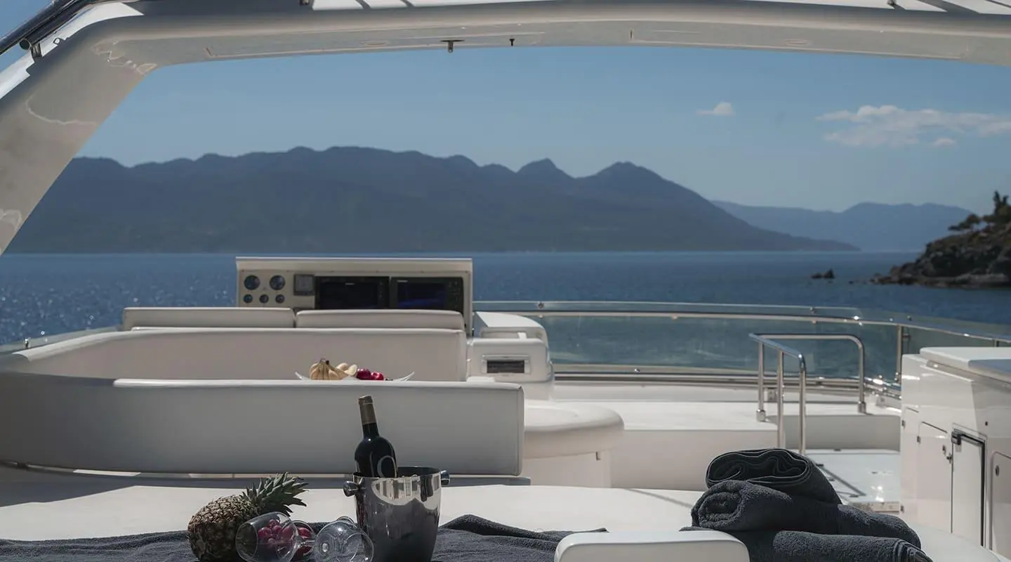Lidia motor yacht flybridge with coastal scenery in view