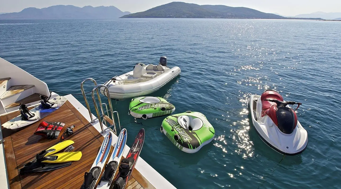 O'Rion yacht view with inflatable boats and motorized dinghies on the water