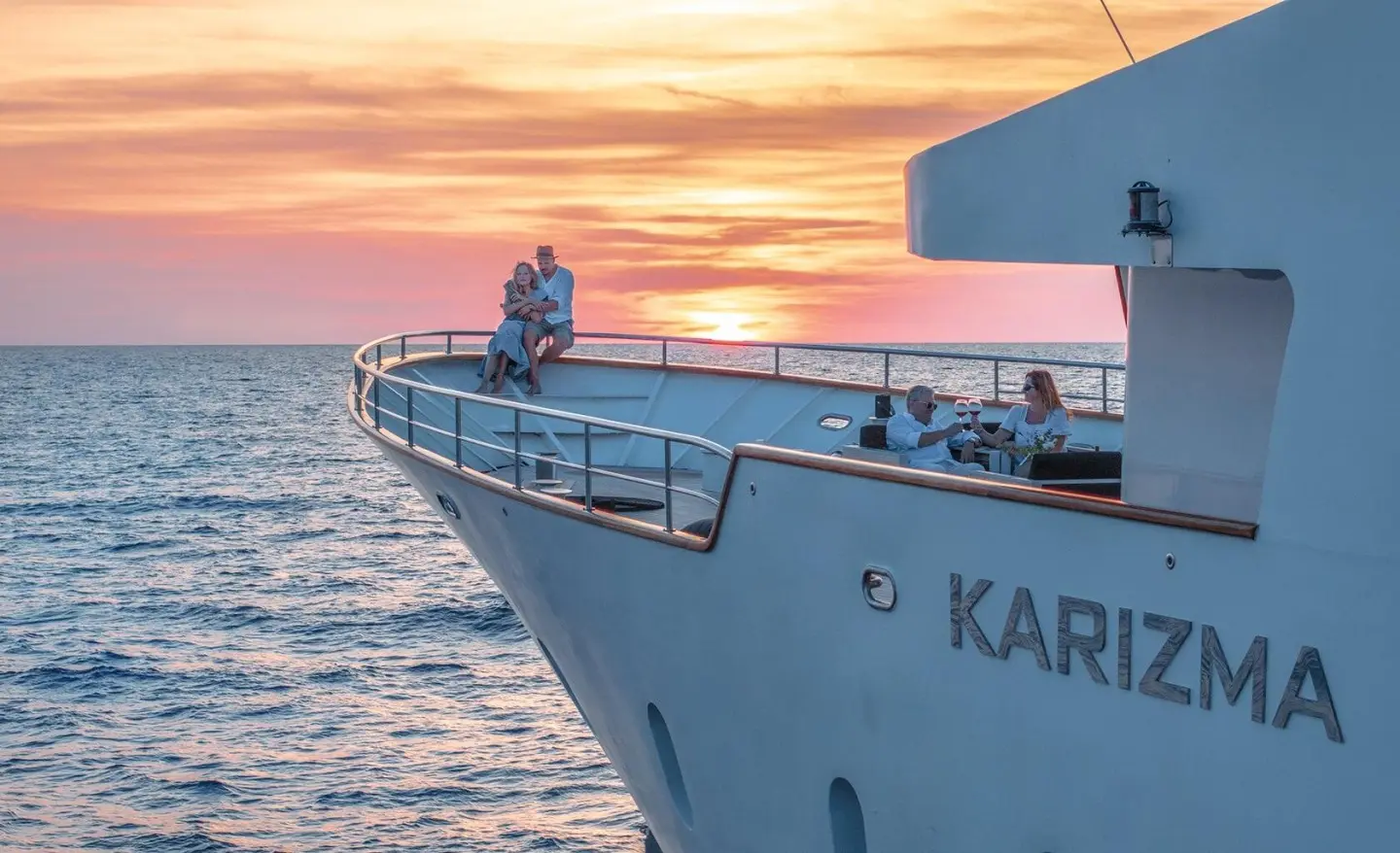 Karizma luxury yacht at sunset, close-up bow and rail on calm sea
