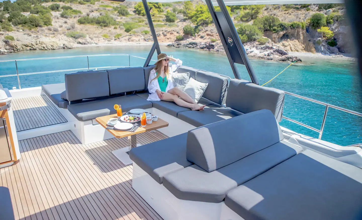 Luxurious yacht D2 exterior seating area with blue cushions and table