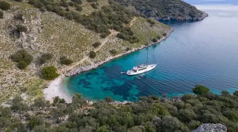 Aerial view of Long Island gulet; blue sea, coastline, yacht near shore