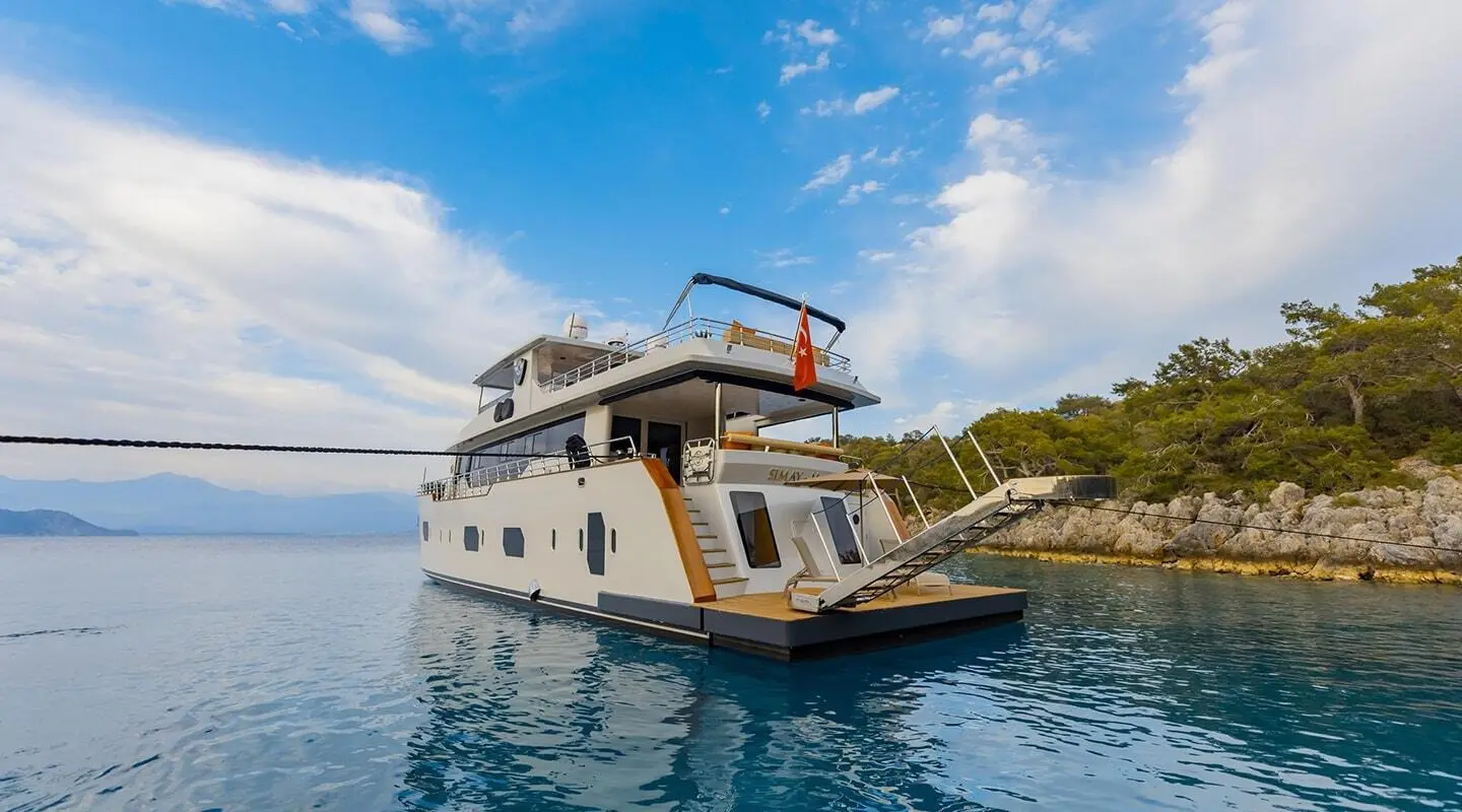 Simay M yacht with swim platform in clear turquoise water