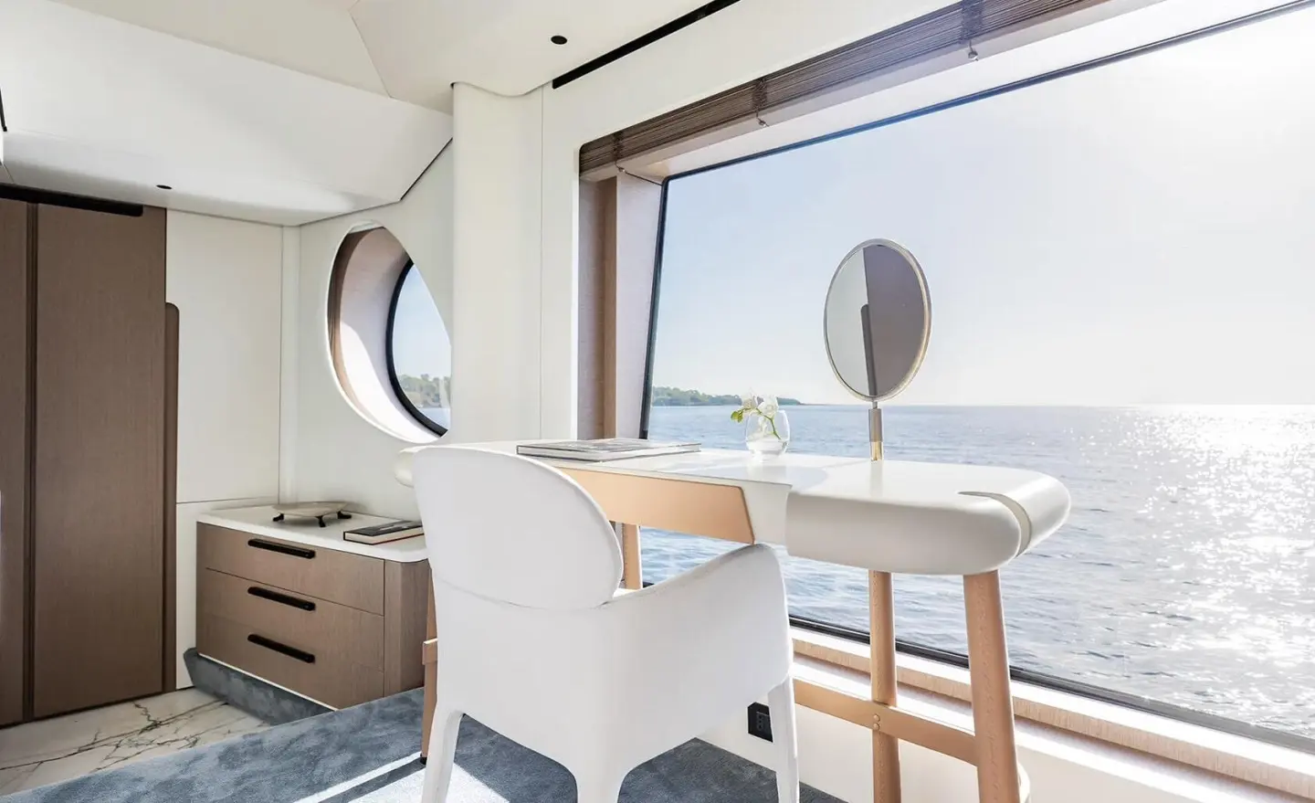 Viva II yacht exterior: white hull, large windows, deck seating near railing