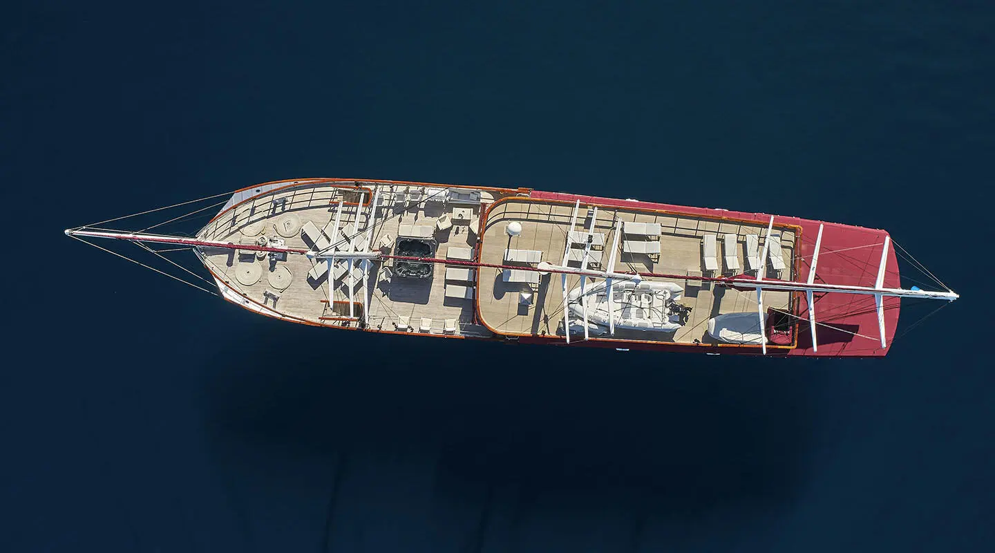 Top-down view of Amorena yacht dining deck with seating and deck fittings