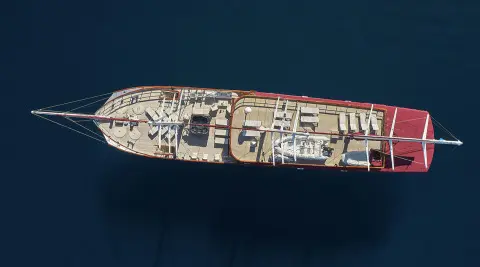 Top-down view of Amorena yacht dining deck with seating and deck fittings
