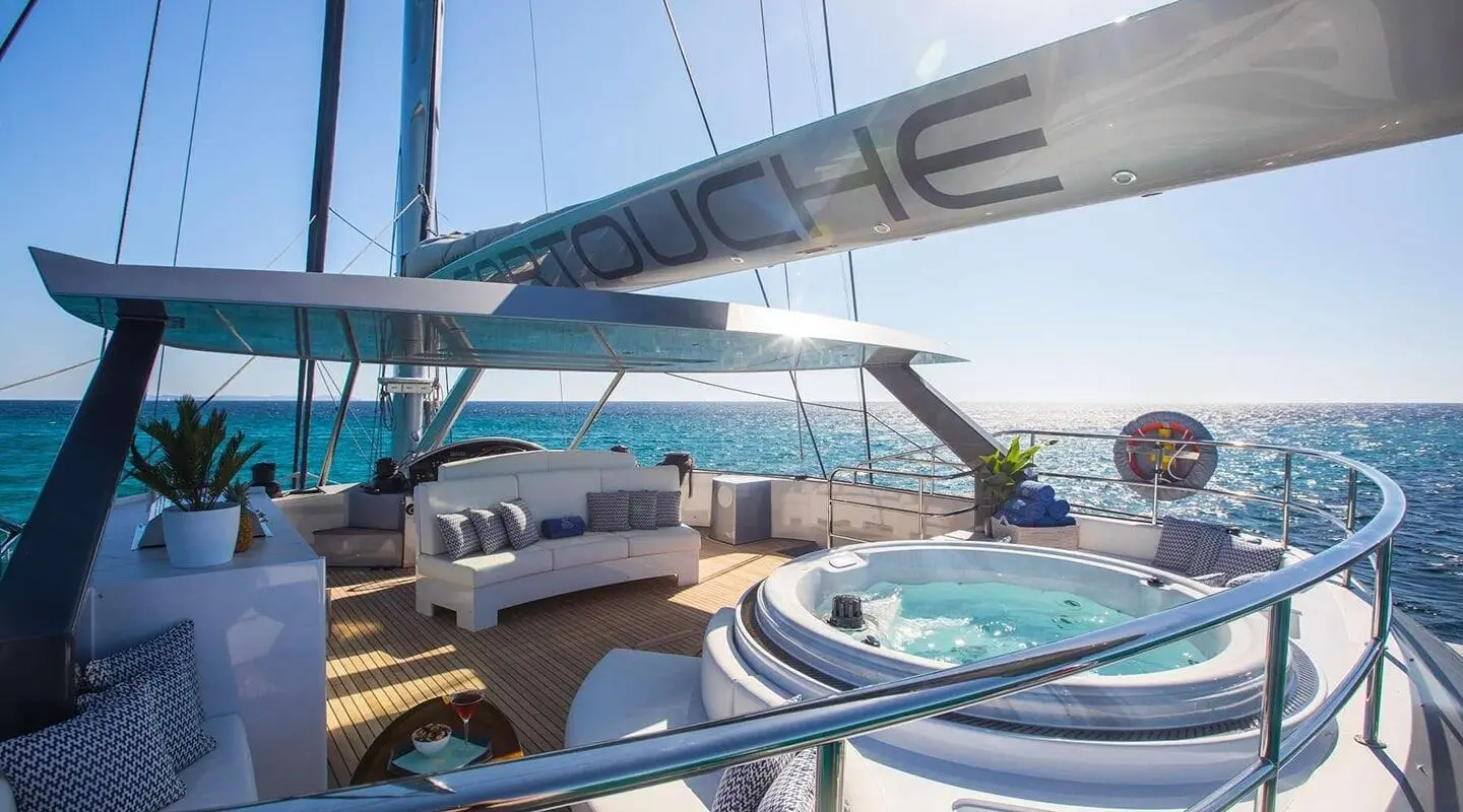 Cartouche luxury yacht with deck seating and blue sky
