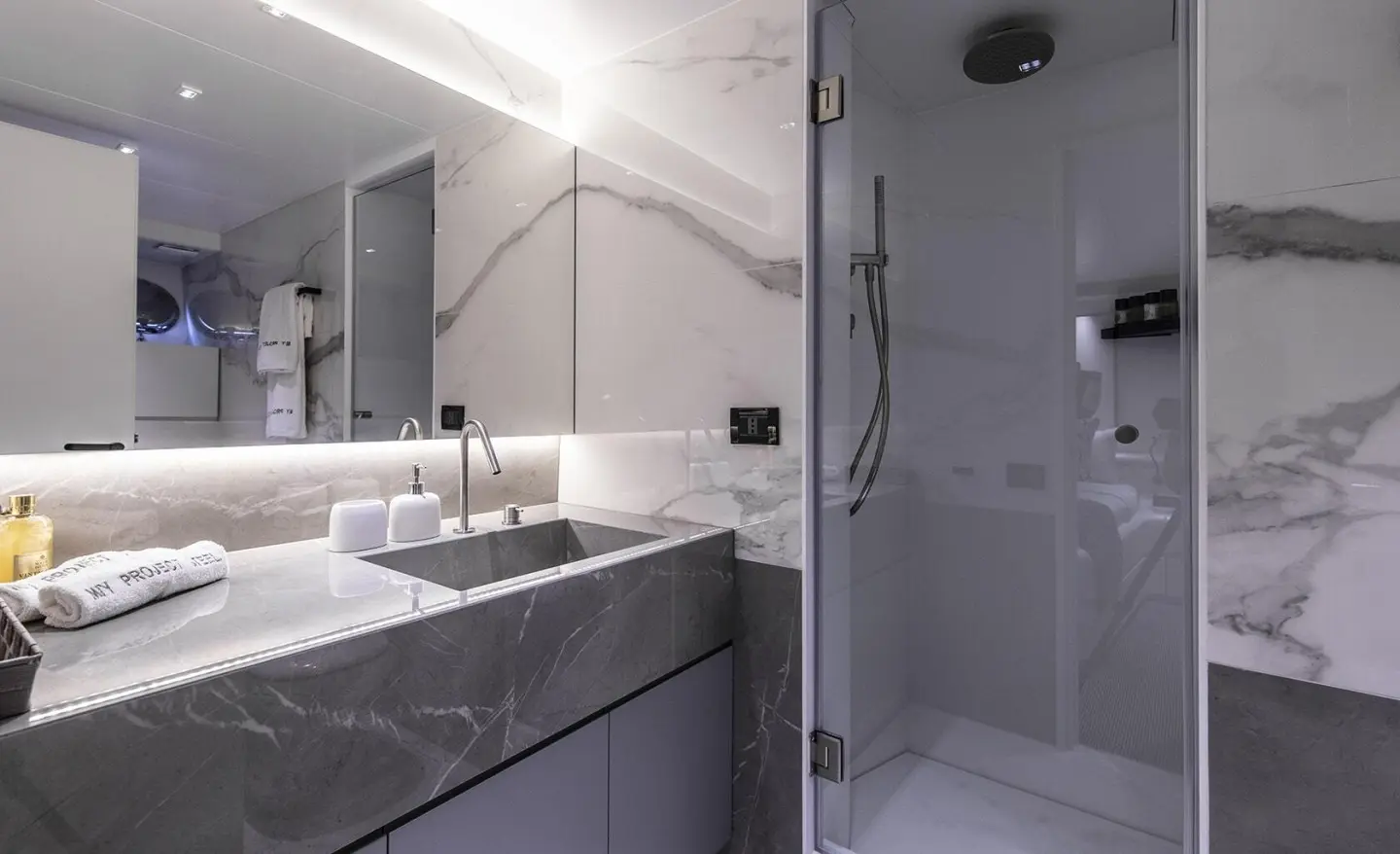 Project Steel yacht exterior deck and modern bathroom area with sleek surfaces