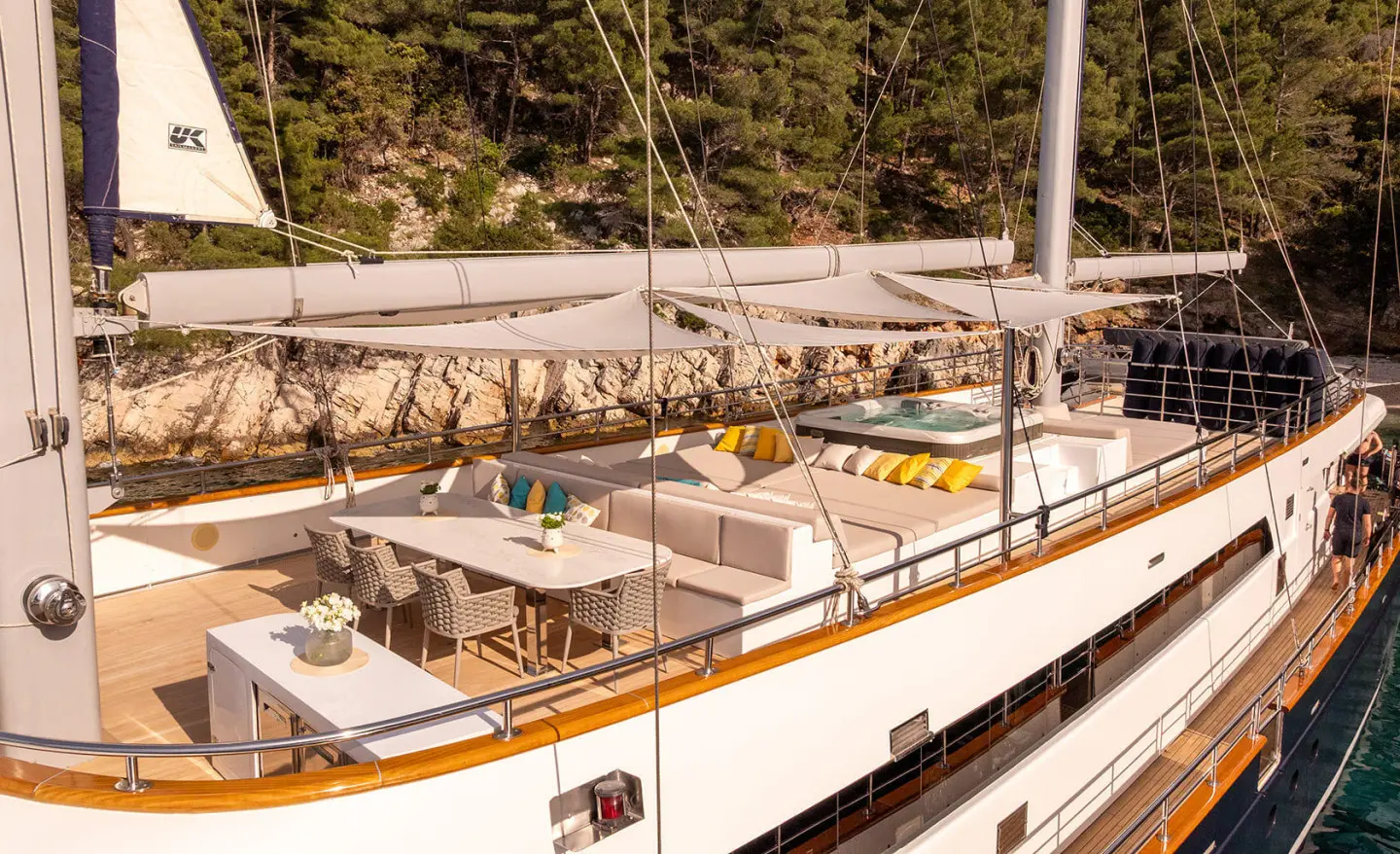 Dalmatino motor yacht deck with sun loungers and seating near railing