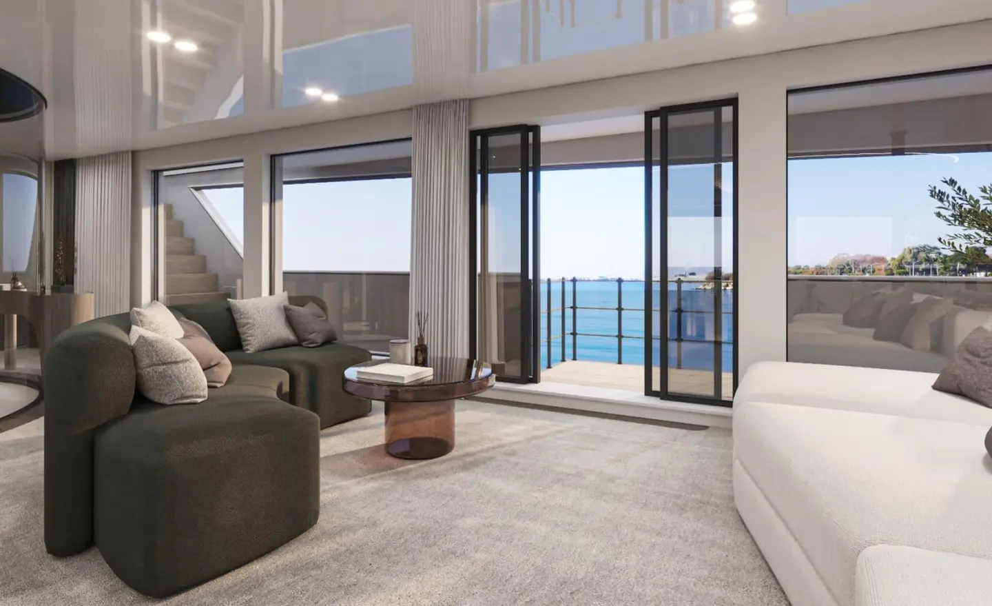 Interior of Bello luxury yacht with lounge seating and ocean view windows