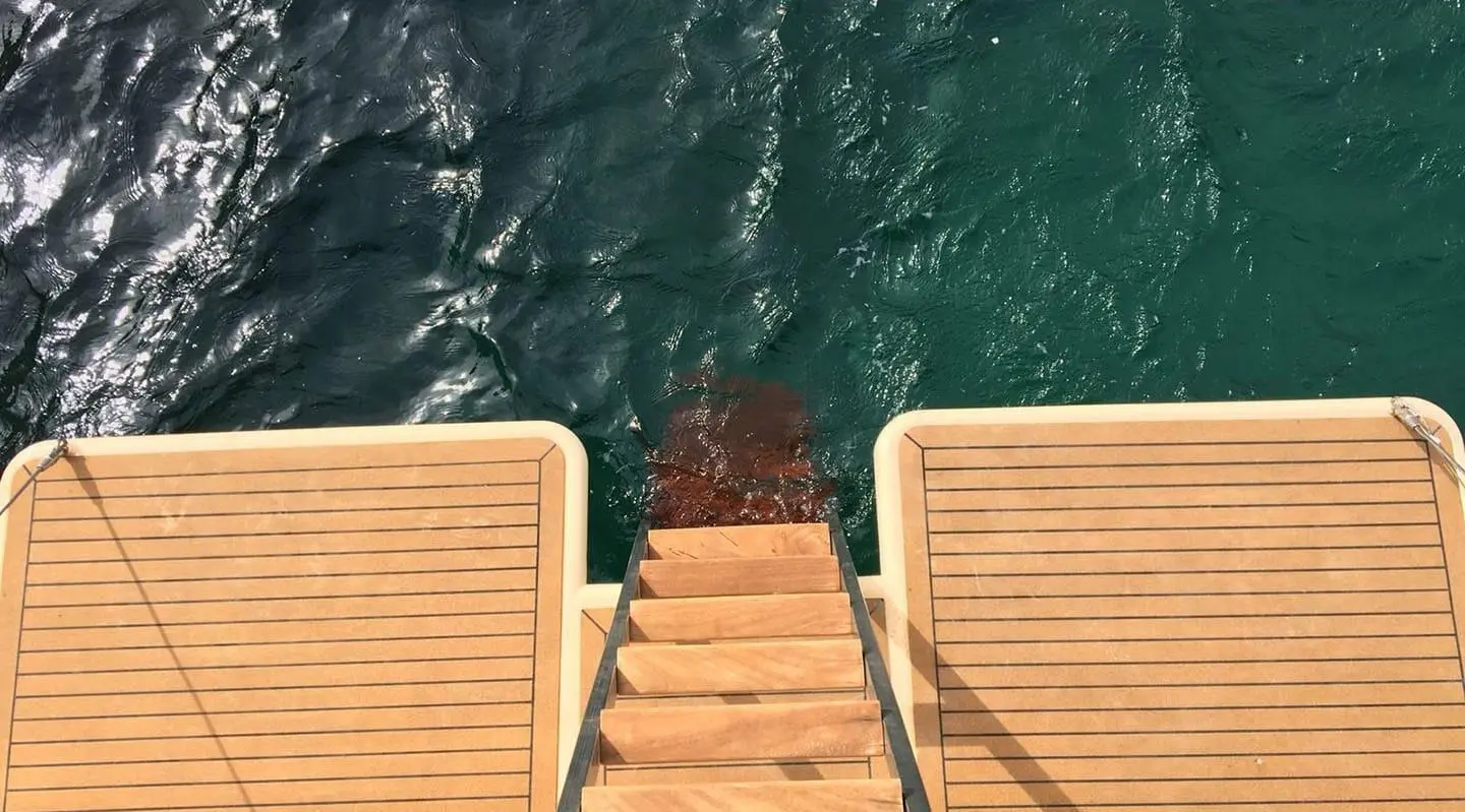 Tajna Mora yacht swimming platform with wooden gangway leading to water