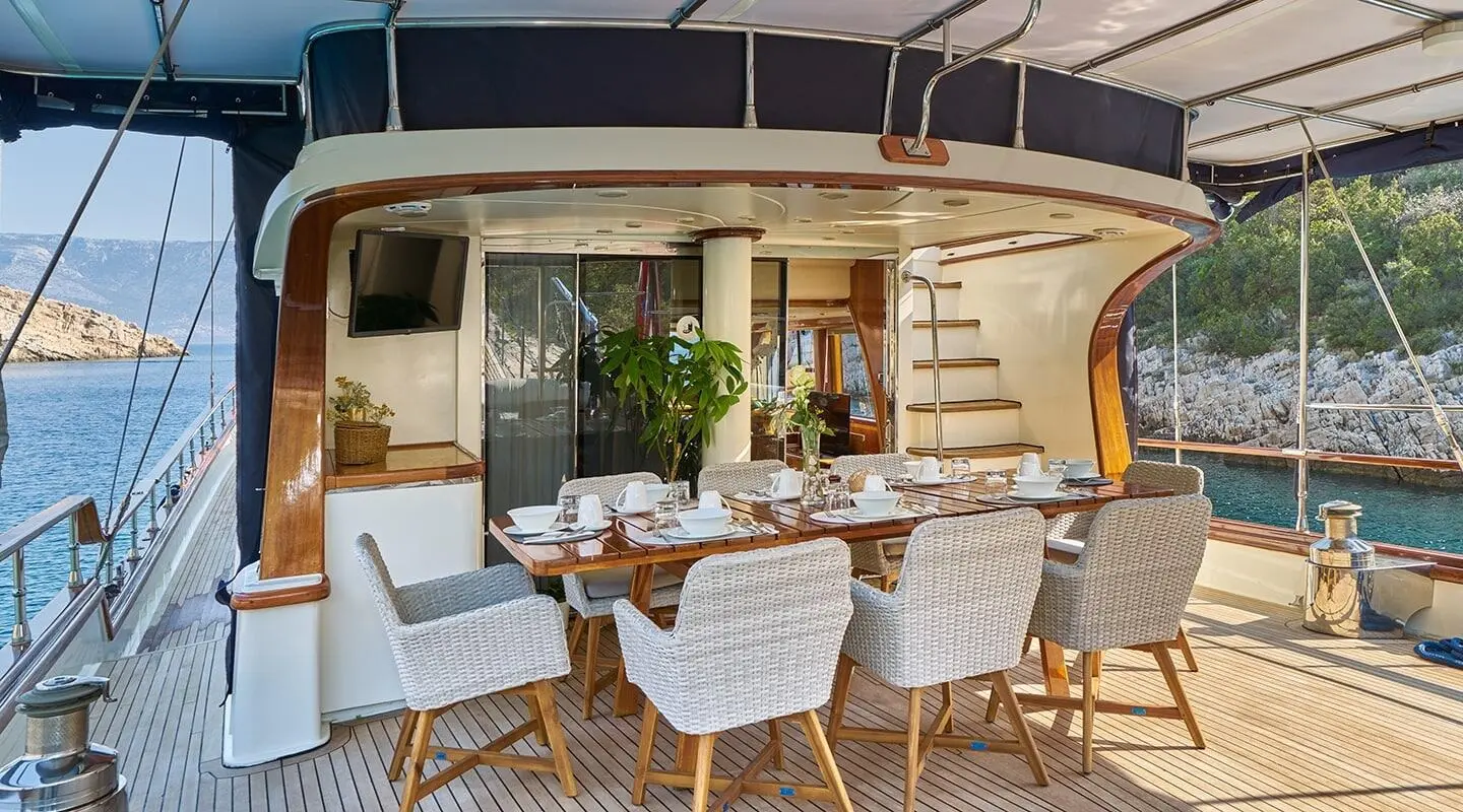 Lotus luxury gulet at sunset with outdoor dining deck and seating