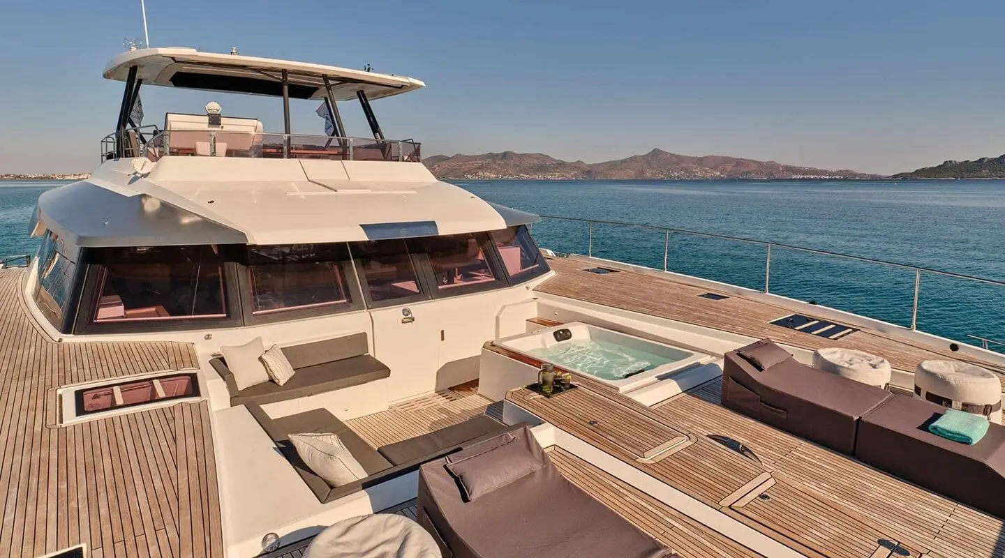 Christal Mio luxury yacht on deck with seating, hot tub, and panoramic windows